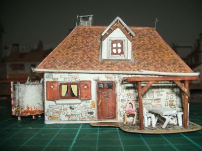 le village de dimanche illustré page 6 la maison du riche
le salon d'été et la porte de derrière. C'est pour y prendre l'apéritif dès qu'il fait beau. 
